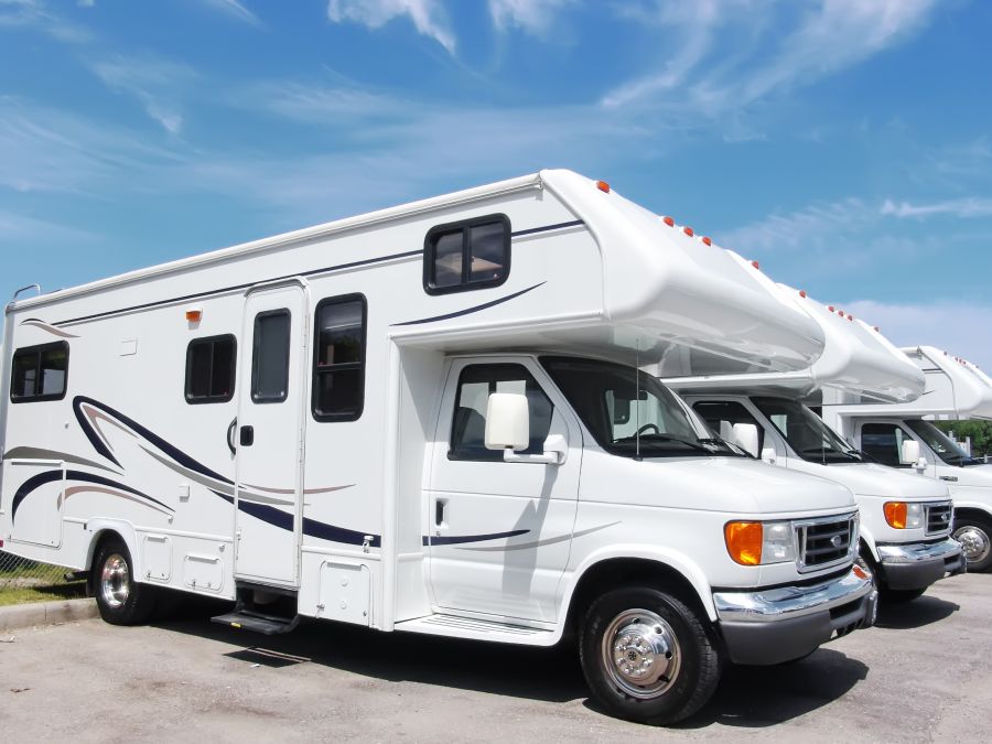 White caravan against a blue sky, illustrating caravan finance in New Zealand